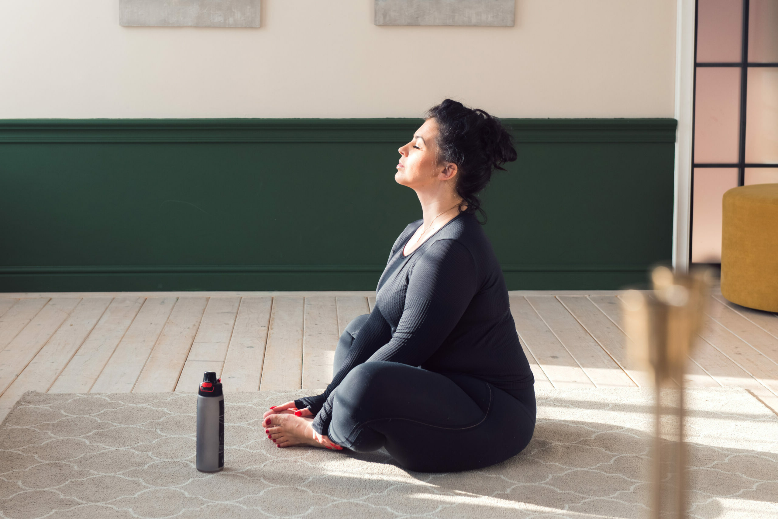 Woman sat cross-legged doing yoga