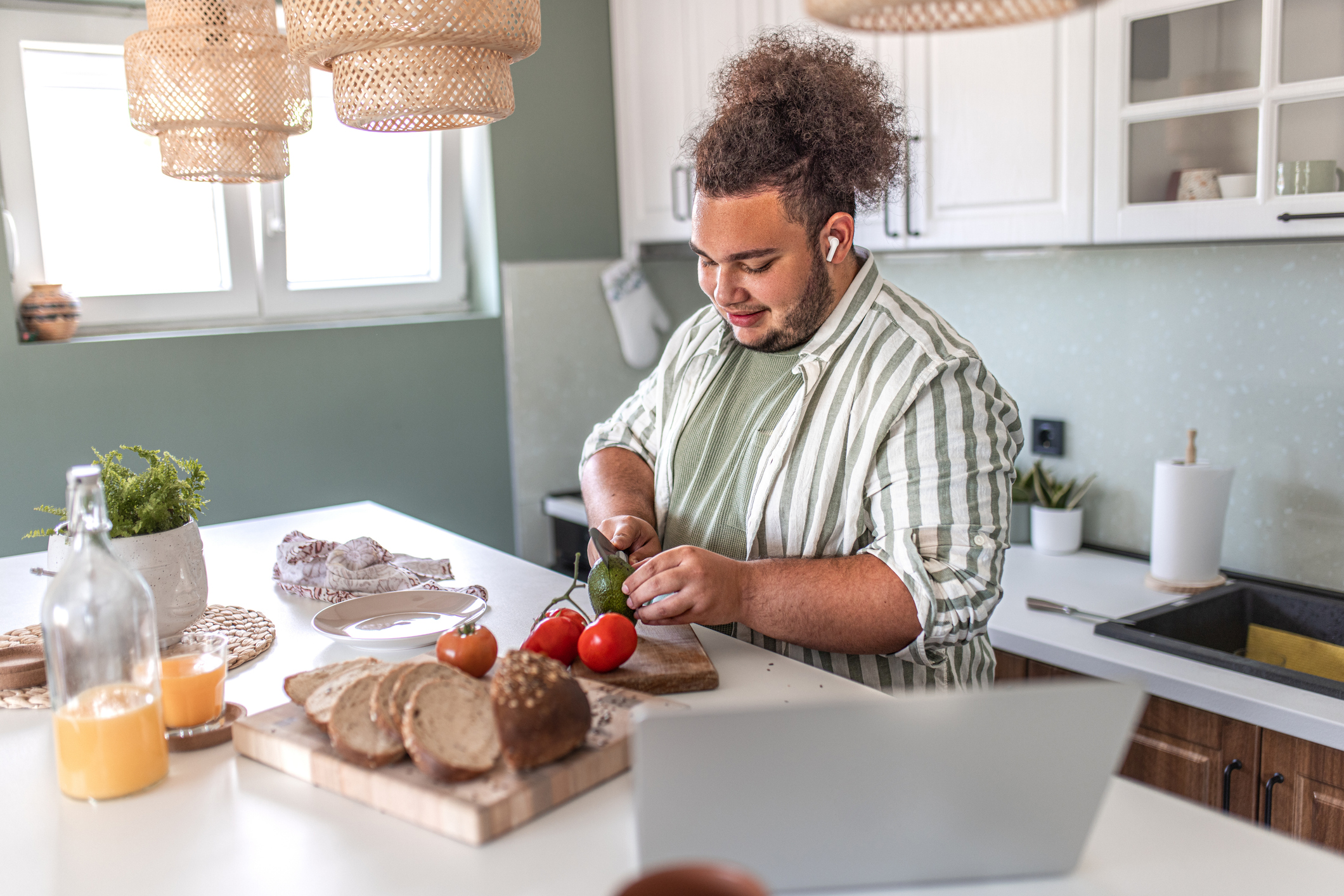Man making breakfast at his kitchen